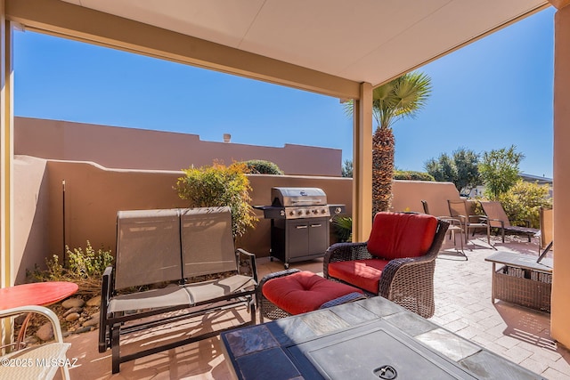 view of patio with an outdoor hangout area and a grill