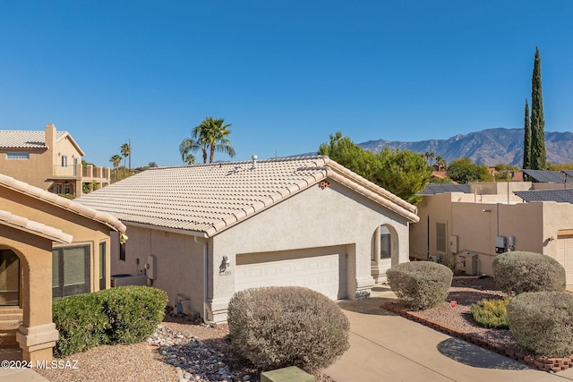 view of front of house featuring a mountain view and a garage