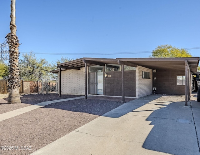 exterior space with a carport