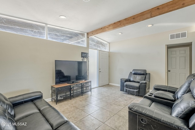 living room with light tile patterned floors and lofted ceiling with beams