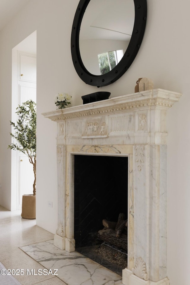 room details featuring a high end fireplace