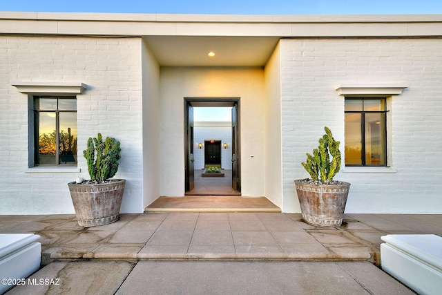 entrance to property with a patio area