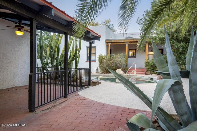 view of patio / terrace with a fenced in pool