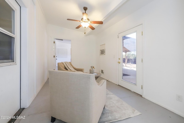 living room with ceiling fan and vaulted ceiling