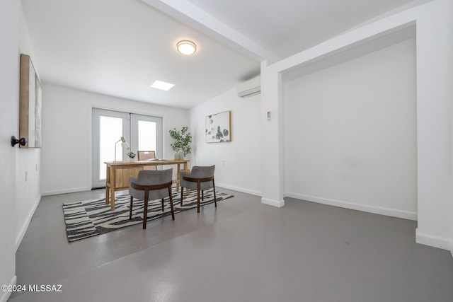 dining room with a wall unit AC and french doors