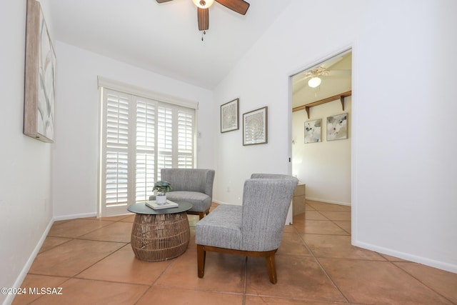 sitting room with tile patterned floors, ceiling fan, and vaulted ceiling