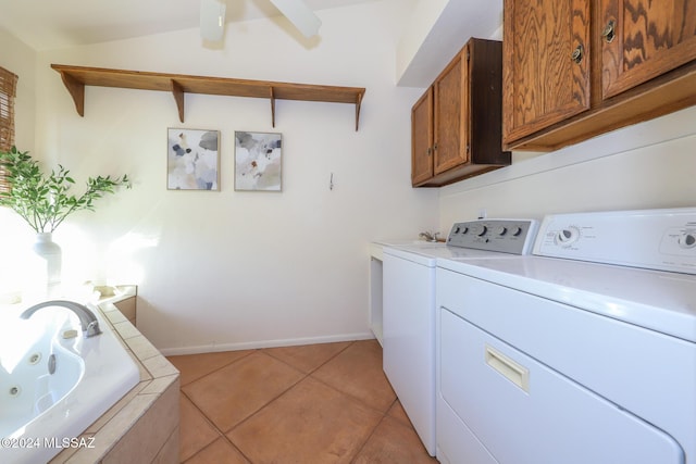 washroom with cabinets, light tile patterned floors, and separate washer and dryer