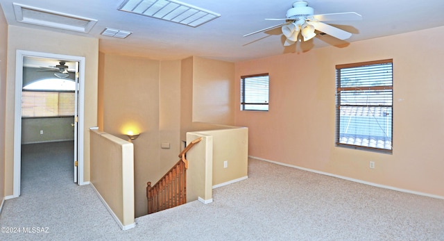 hallway with light colored carpet