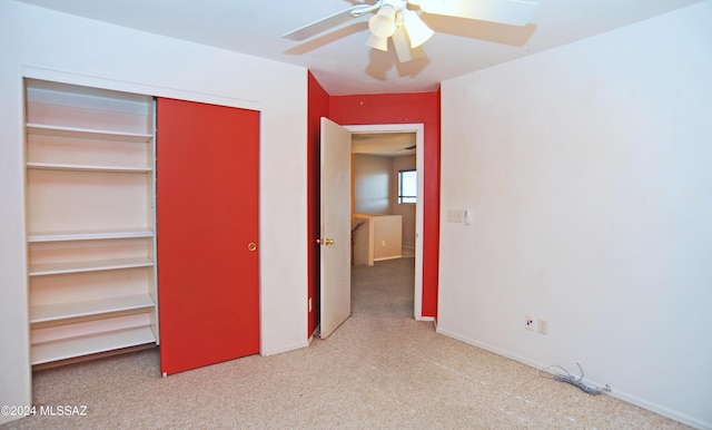 unfurnished bedroom with light colored carpet, a closet, and ceiling fan