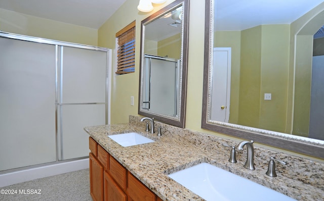 bathroom with vanity and an enclosed shower