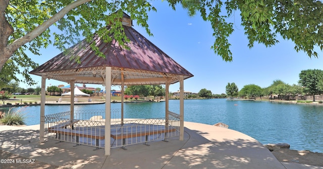 view of dock featuring a gazebo and a water view