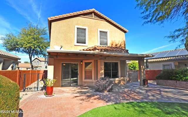 back of house featuring a patio