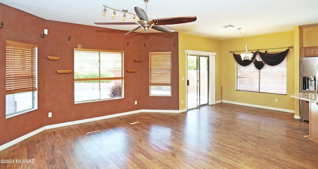 spare room featuring ceiling fan and wood-type flooring