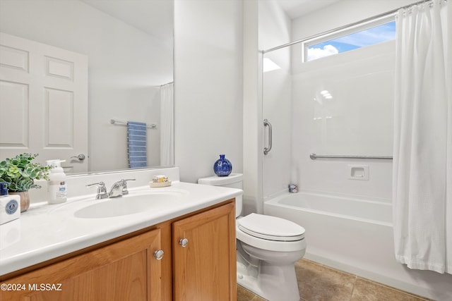 full bathroom with tile patterned flooring, shower / tub combo with curtain, vanity, and toilet