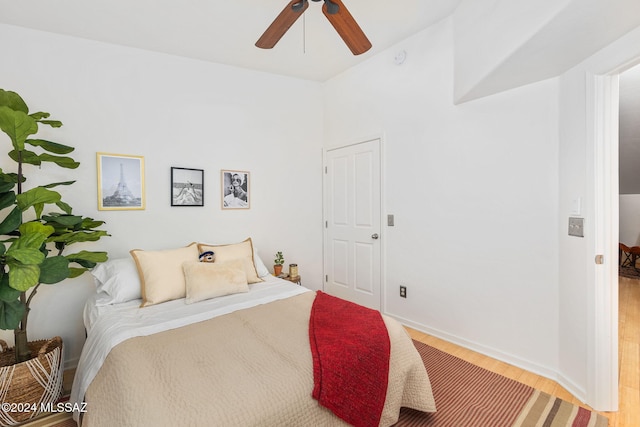 bedroom with ceiling fan and light hardwood / wood-style floors