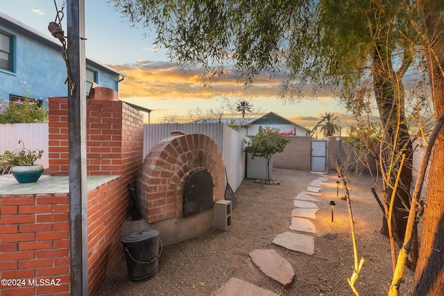 view of yard at dusk