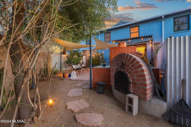 view of patio terrace at dusk