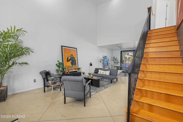 living room with a high ceiling