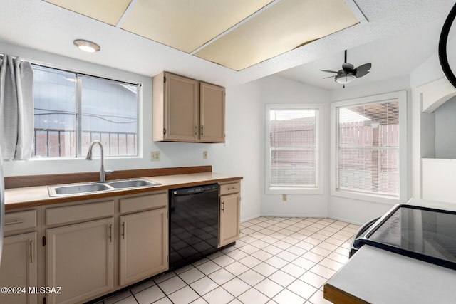 kitchen with ceiling fan, sink, black dishwasher, vaulted ceiling, and light tile patterned flooring