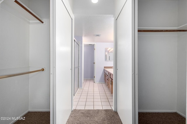 bathroom featuring tile patterned floors and vanity