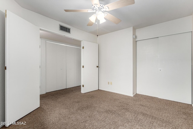 unfurnished bedroom with carpet flooring and ceiling fan