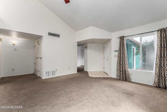 unfurnished living room with carpet flooring, high vaulted ceiling, and ceiling fan