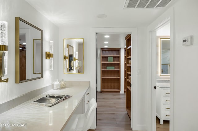 bathroom featuring vanity and hardwood / wood-style flooring