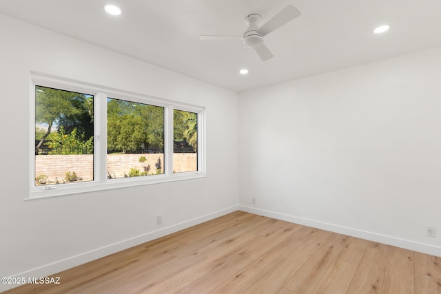 unfurnished room with ceiling fan and light hardwood / wood-style flooring