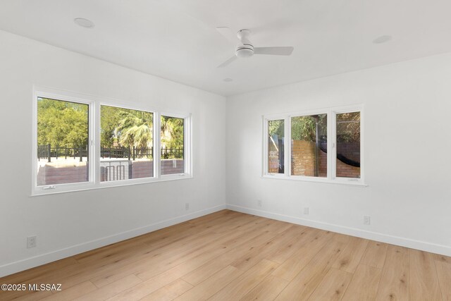 unfurnished room featuring light hardwood / wood-style floors and ceiling fan