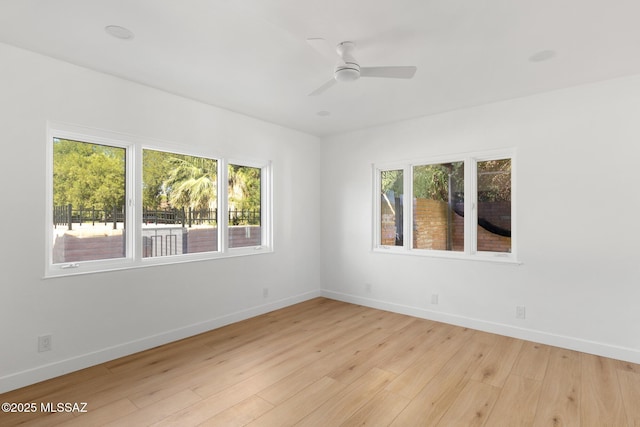 unfurnished room featuring ceiling fan and light wood-type flooring