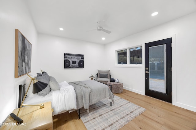 bedroom with ceiling fan, access to exterior, and hardwood / wood-style floors