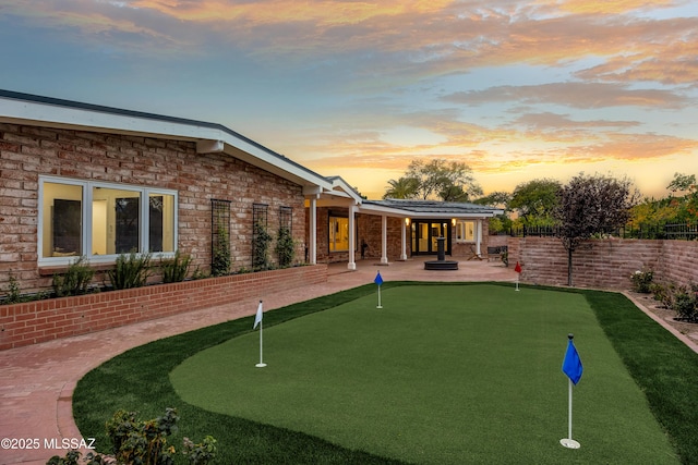 view of property's community with a patio area