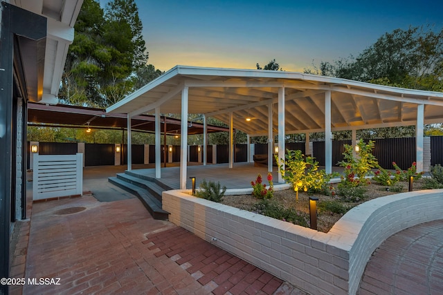 view of patio terrace at dusk