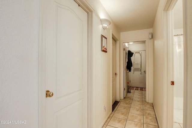 corridor with light tile patterned floors