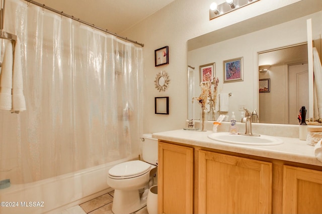 full bathroom featuring toilet, shower / bath combo, vanity, and tile patterned floors