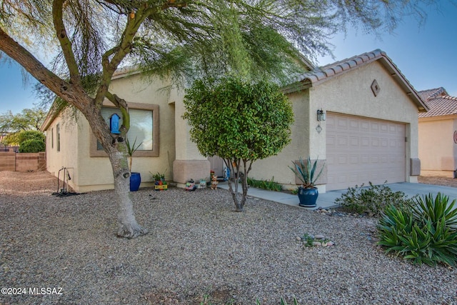 view of front of property with a garage