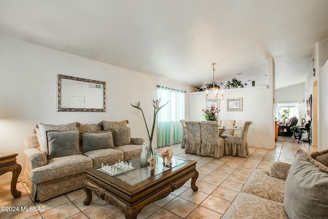 tiled living room featuring lofted ceiling, a wealth of natural light, and a chandelier