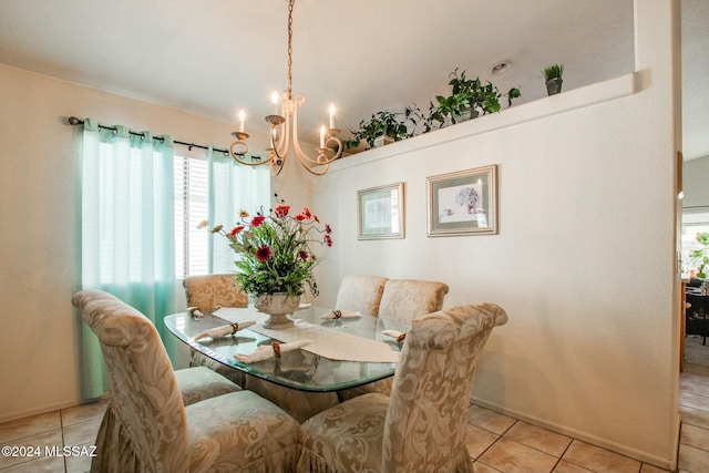 dining room featuring an inviting chandelier and light tile patterned flooring