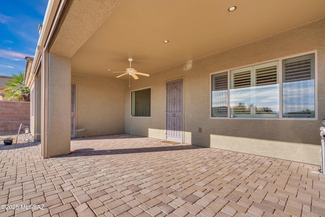 view of patio / terrace featuring ceiling fan