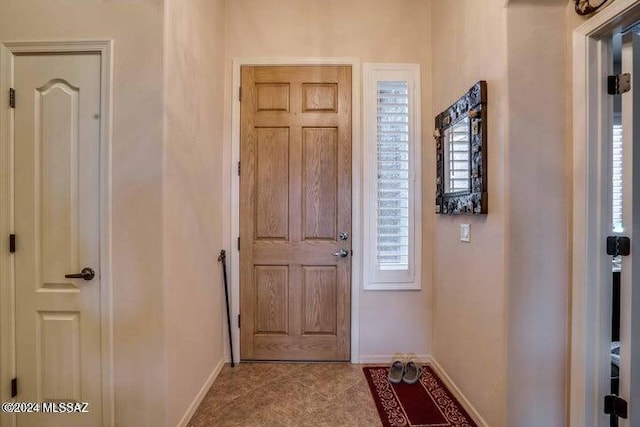 interior space with light tile patterned floors