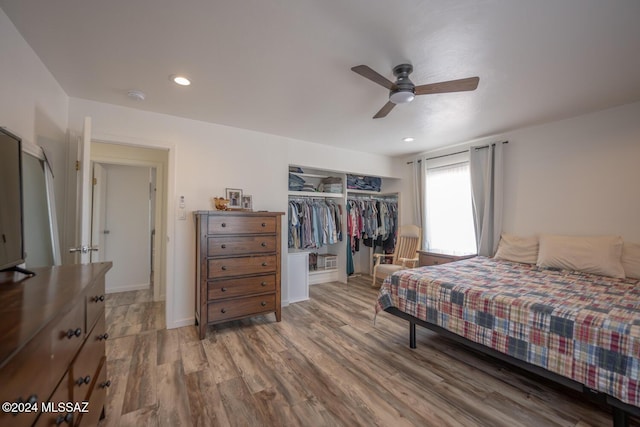 bedroom featuring ceiling fan, a closet, wood finished floors, and recessed lighting