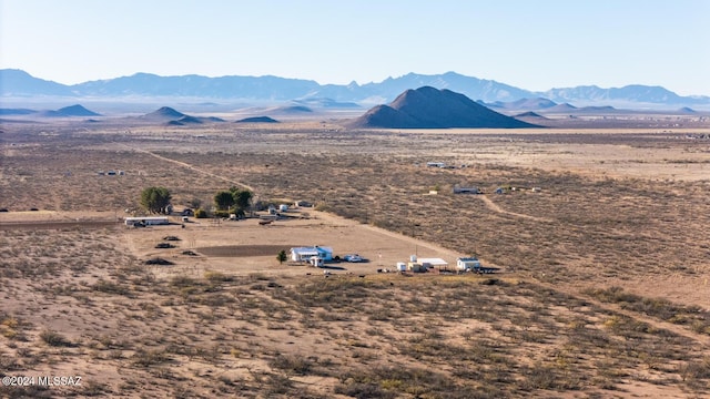 bird's eye view featuring a rural view, a mountain view, and a desert view