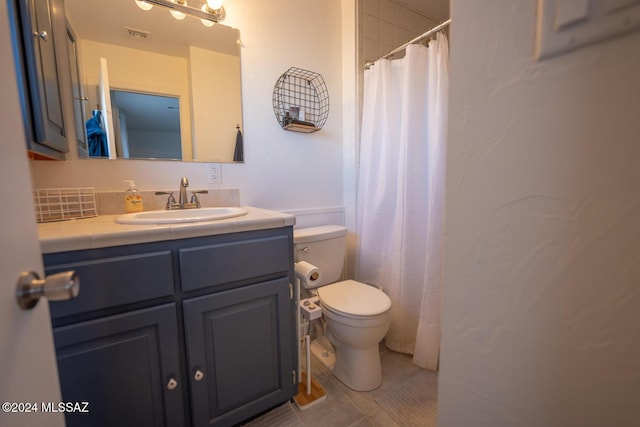 bathroom with tile patterned flooring, visible vents, vanity, and toilet