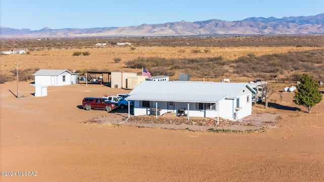 birds eye view of property with a mountain view