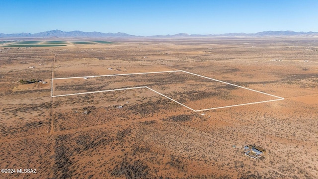 bird's eye view with a mountain view and a desert view