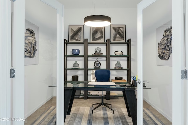 home office featuring baseboards