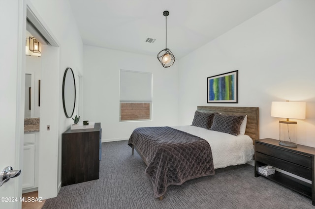 bedroom featuring dark carpet