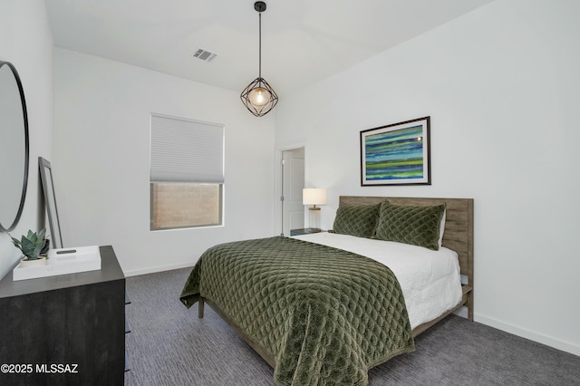 bedroom featuring carpet floors, visible vents, and baseboards