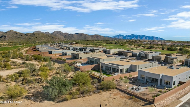 birds eye view of property featuring a mountain view