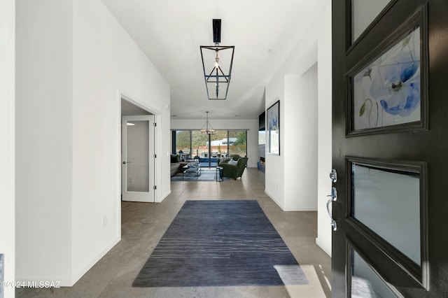 hallway with tile patterned flooring and french doors